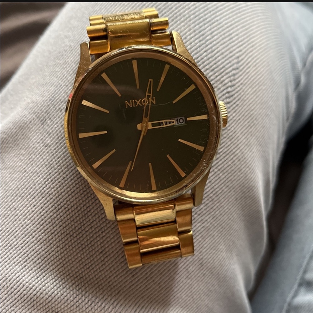 Green face Gold Nixon watch Unisex